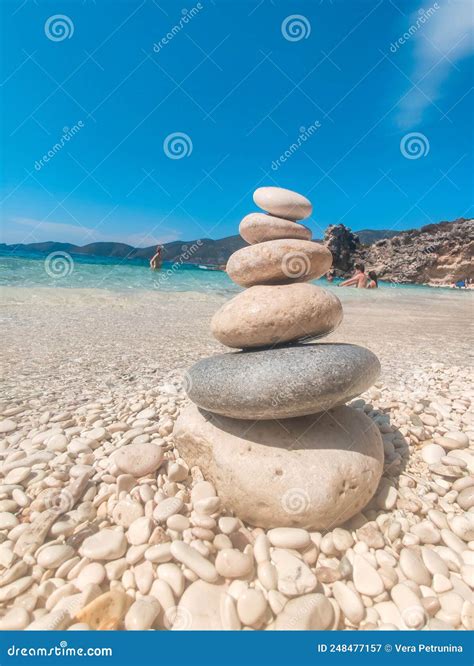 Woman in Blue Swimsuit at the Rock Sunbathing Stock Image - Image of