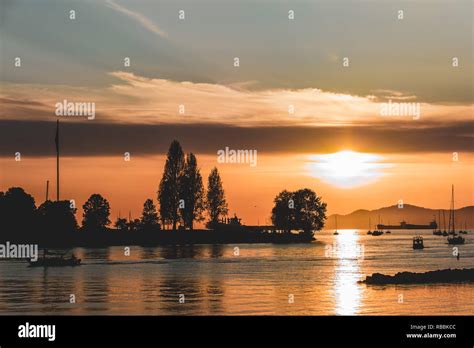 photo  sunset  sunset beach  vancouver bc canada stock photo