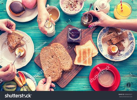 Young Happy Family Having Breakfast Stock Photo 380603521 | Shutterstock