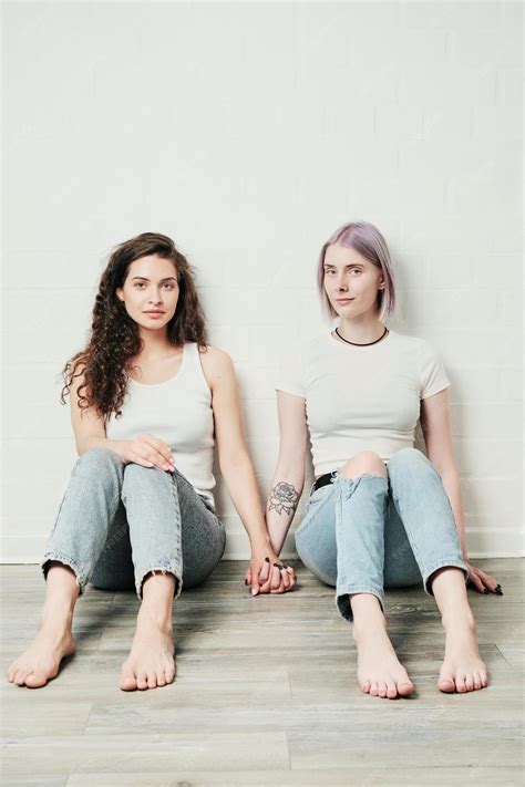 Premium Photo | Portrait of content young caucasian lesbians in jeans