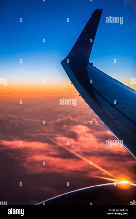 Sunset view from the airplane window Stock Photo - Alamy