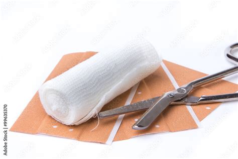 pflaster mit schere und mullbinde stock foto adobe stock