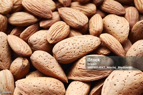 close  picture  raw almonds  shell  shelled stock photo