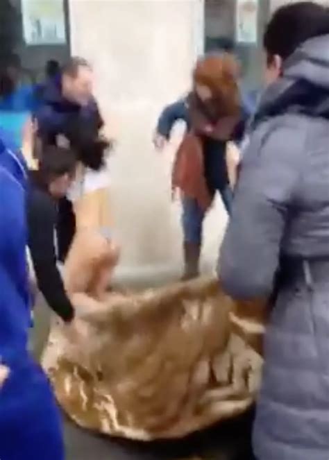 Dramatic footage shows rescuers CATCHING semi-naked woman as she jumps