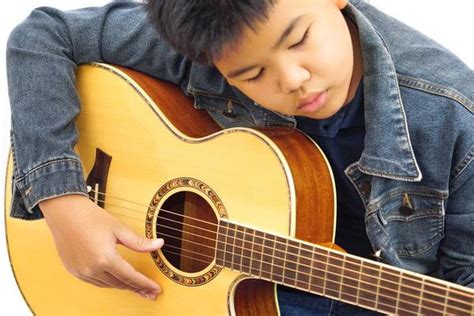 Child Playing Guitar Stock Photos, Images and Backgrounds for Free Download