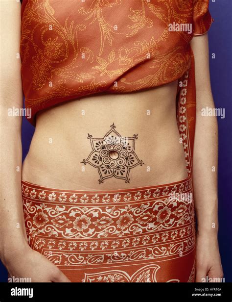 Henna belly button tattoo Stock Photo - Alamy