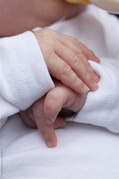 "Newborn Babies Hands" by Stocksy Contributor "Rowena Naylor" - Stocksy
