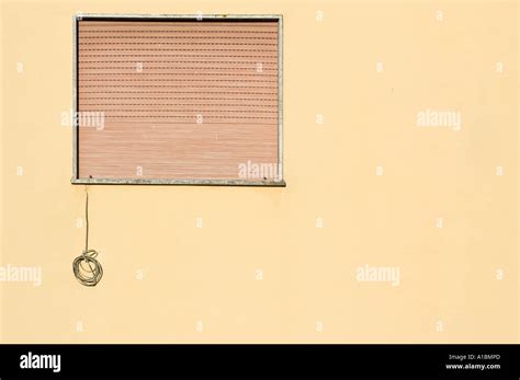 coiled electrical cable hanging   window stock photo alamy