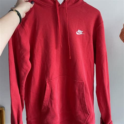 red nike hoodie has some small marks but are barely... - Depop