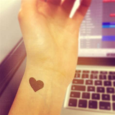 heart on wrist tattoo 11