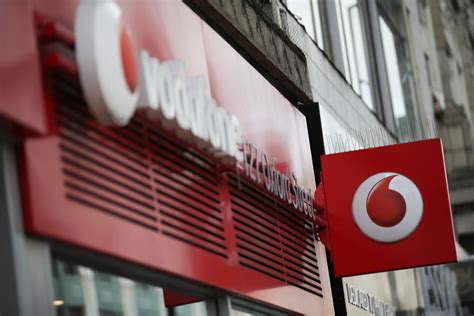 vodafone chairman defends dividend cut  firm fends  pay revolt