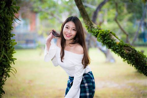 Radiant Asian Beauty: 4K Ultra HD Portrait of Smiling Brunette with
