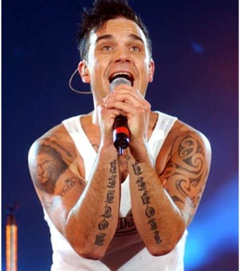 decouvrez tous les tatouages de robbie williams