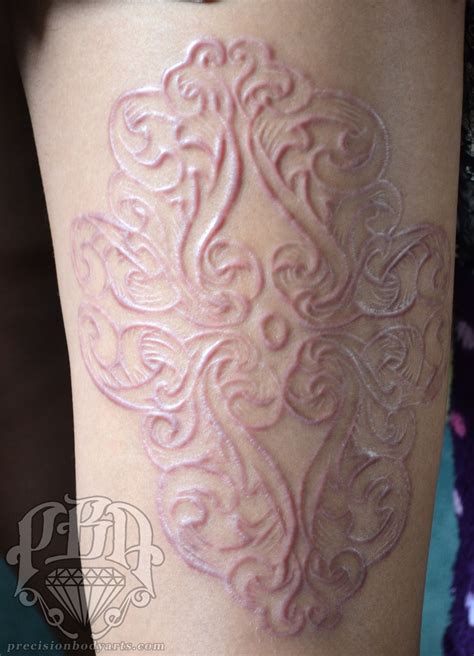 Healed scarification performed by Ryan Ouellette at London ScarCon 2013