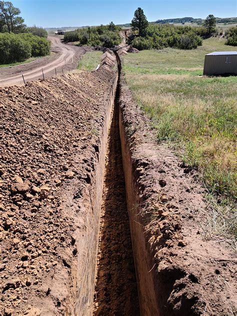 trench dirt dogs excavating