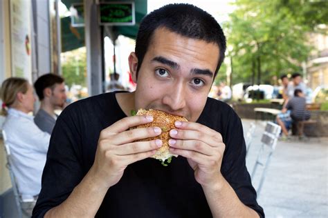 Eating a Veggie Burger | Person eating a burger at a restaur… | Flickr