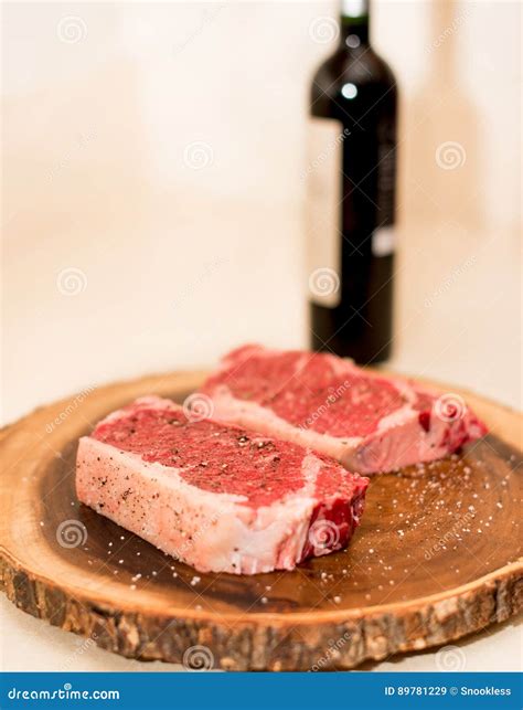 New York Strip Steaks and Wine Stock Image - Image of food, grilling