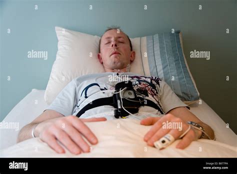 man sleeping   overnight home based sleep study wearing
