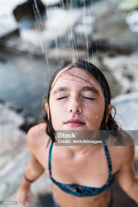 Teenage Girl Taking An Outdoors Shower Stock Photo - Download Image Now