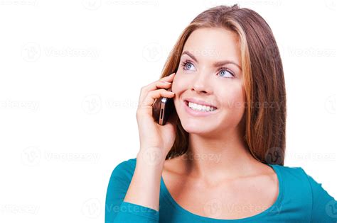 Communication in pleasure. Beautiful young women talking on the mobile ...