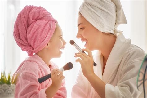 Premium Photo | Mother and daughter are doing make up