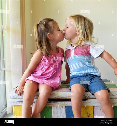 toddler boy  girl kissing stock photo alamy