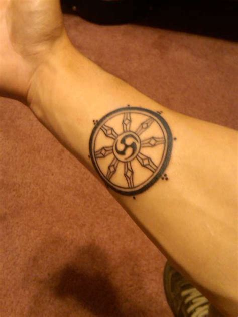 Wheel of Dharma tattoo // I want this so bad. Maybe in between my ...