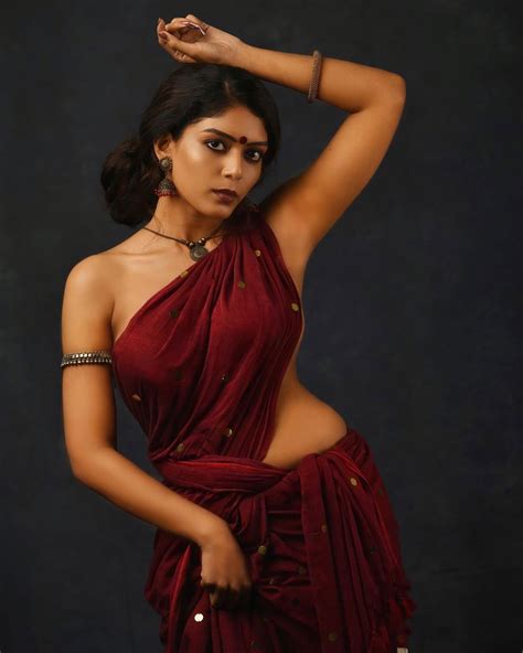 Raksha Cherin sizzling stills in blouse-less saree - South Indian Actress