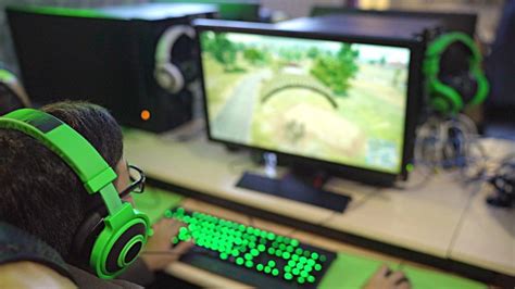 shot  gamer playing computer games  internet cafe   flickr
