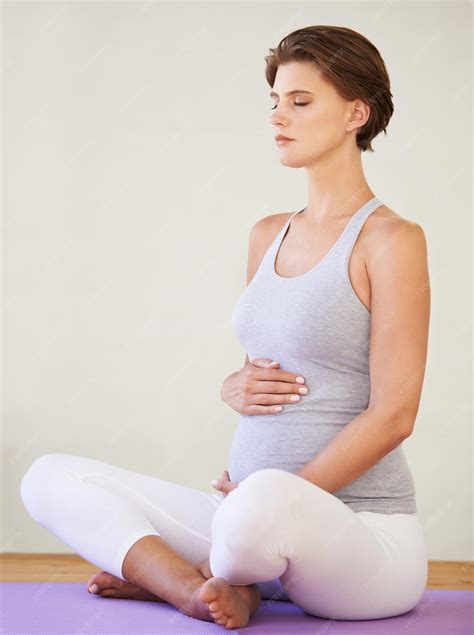 Premium Photo | Perfect posture even during pregnancy A young pregnant