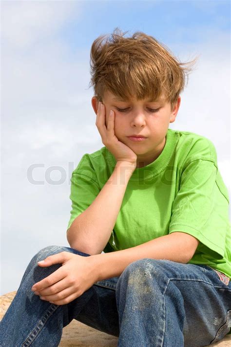 sad unhappy depressed dejected child sitting   thinking