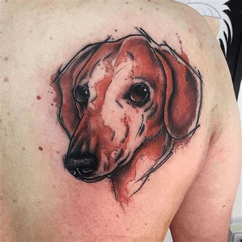 A beautiful watercolor dachshund tattoo.