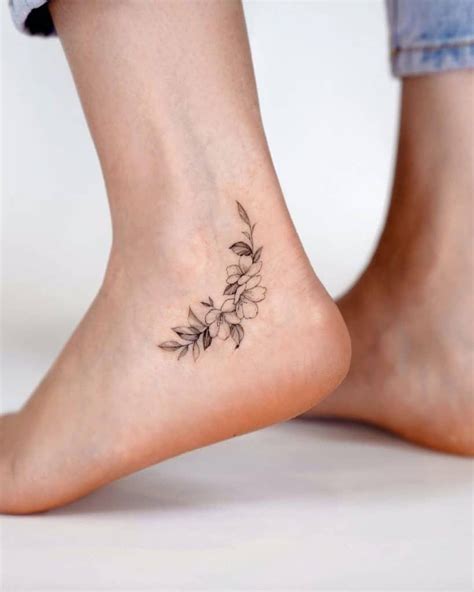 Small Black & White Flower Ankle Tattoo in 2021 | Ankle tattoos for ...