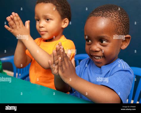 Child clap hands hi-res stock photography and images - Alamy