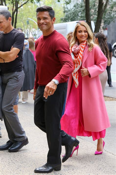 Kelly Ripa and husband Mark Consuelos wear thick wool trench coats and ...