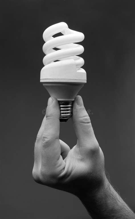 Hand holding spiral lamp stock image. Image of sign, electronics - 18697523