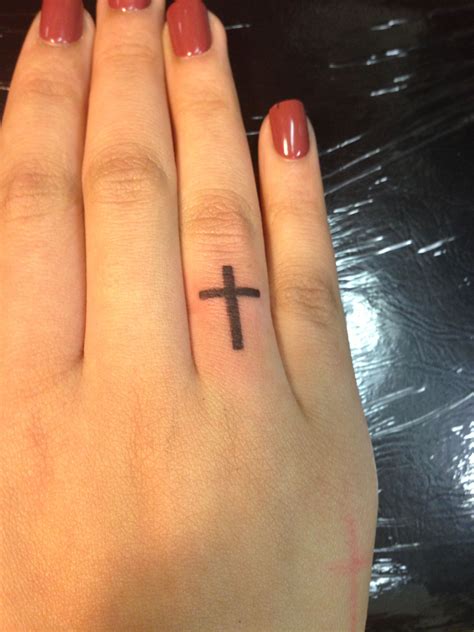 Ring Finger Cross Tattoos