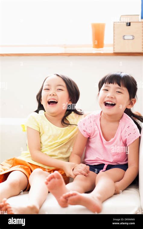 kids sitting on couch Stock Photo - Alamy