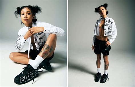 Download Rapper Coi Leray in studio posing Wallpaper | Wallpapers.com