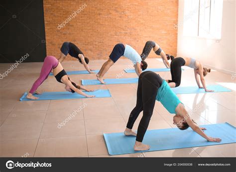 Group People Practicing Yoga Gym Stock Photo by ©serezniy 204550538