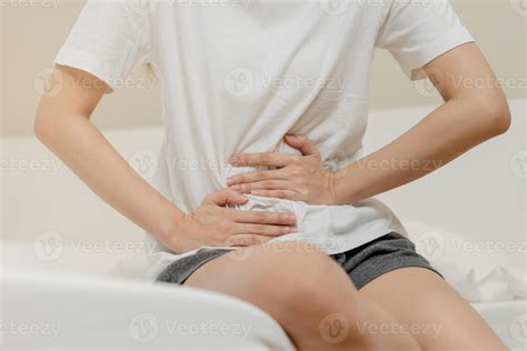 Flatulence ulcer, asian young woman, girl hands in belly, stomachache