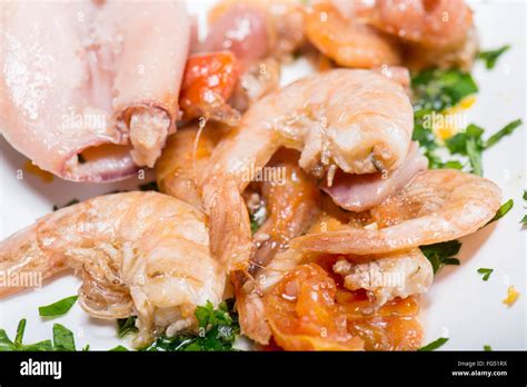 Stuffed squid fried with shrimp Stock Photo - Alamy