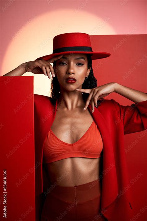 Beauty, fashion and red aesthetic woman in studio for creative art ...