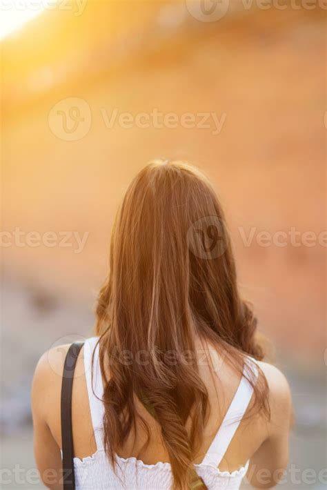 Asian tourists traveling and taking in sights of ancient city wall in