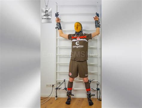 Soccer Emo tied to wall bars and vacuum mask breathplay