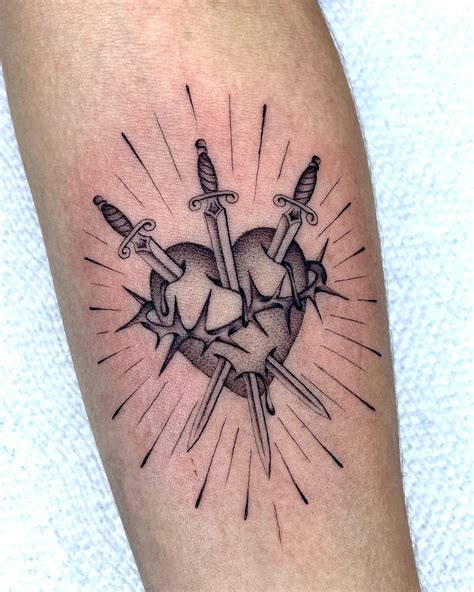 16 Bold Dagger Through a Heart Tattoo Ideas You’ll Love