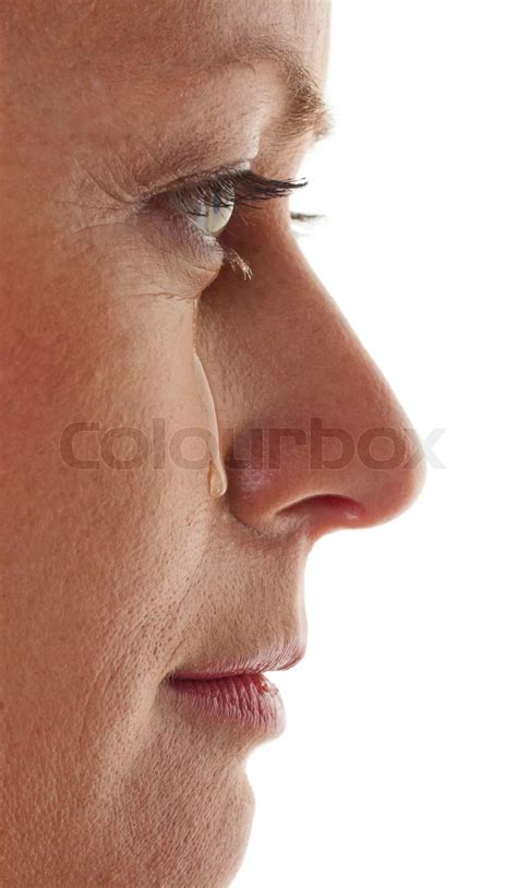 Woman is sad and crying. Tear on her cheek. | Stock image | Colourbox