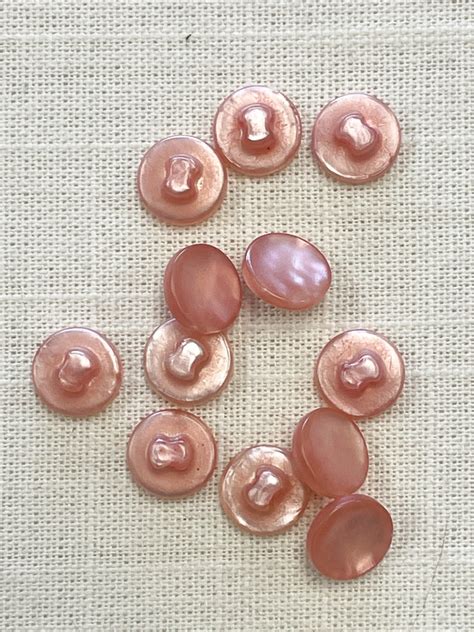 sale plastic shank buttons set   pearlescent pale peach lucky