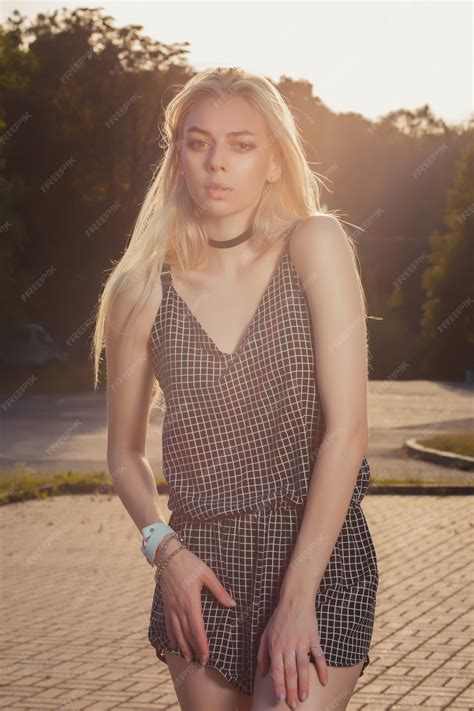Premium Photo | Glorious tanned blonde woman with long hair wearing