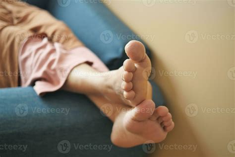 relax women feet lying on sofa in a bright house 25171711 Stock Photo